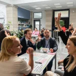 A group of participants sitting in a circle, sharing their experiences and insights.